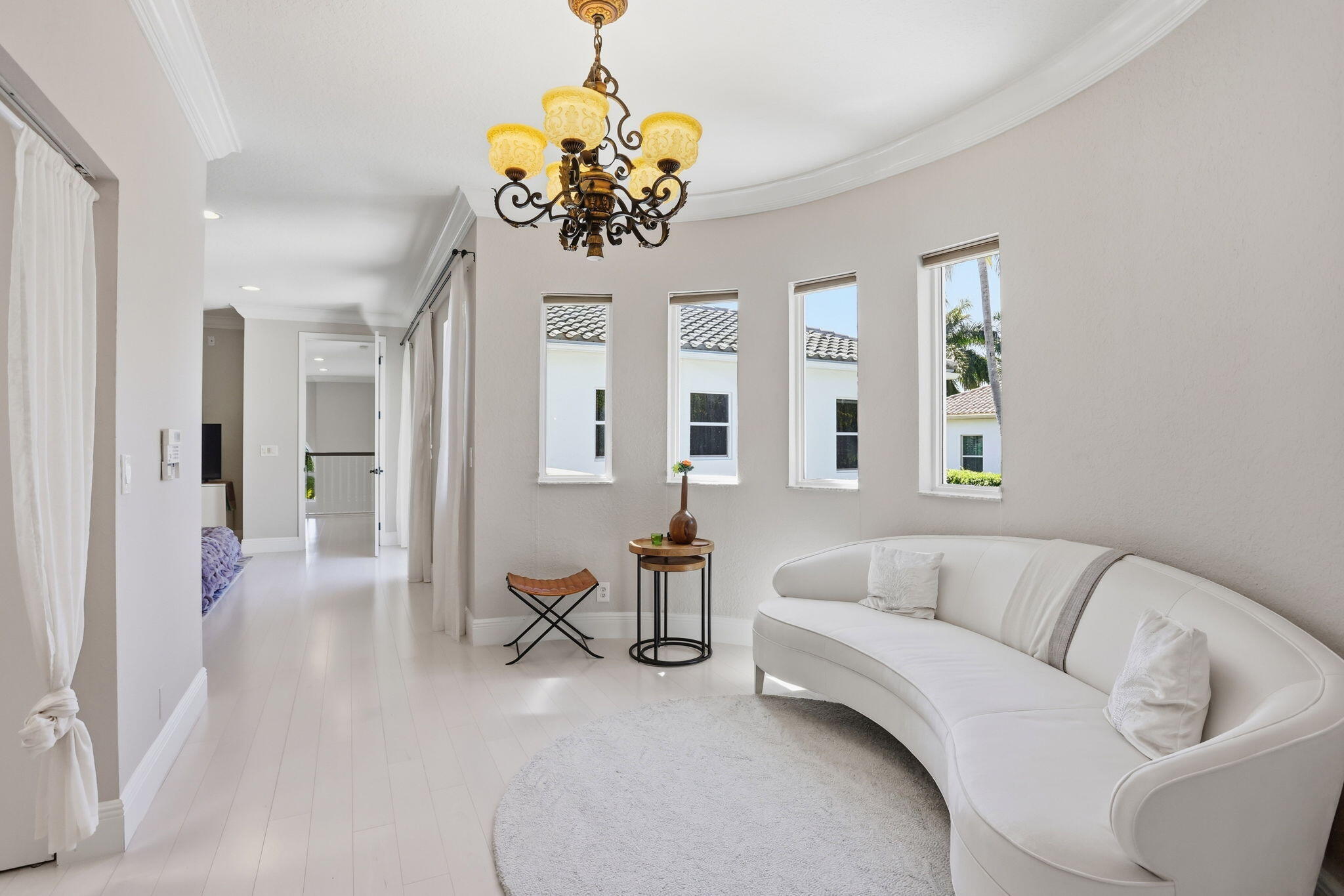 375 Southwest 16th Street Boca Raton, FL 33432 - Photo 20 of 42 a living room with furniture and a chandelier