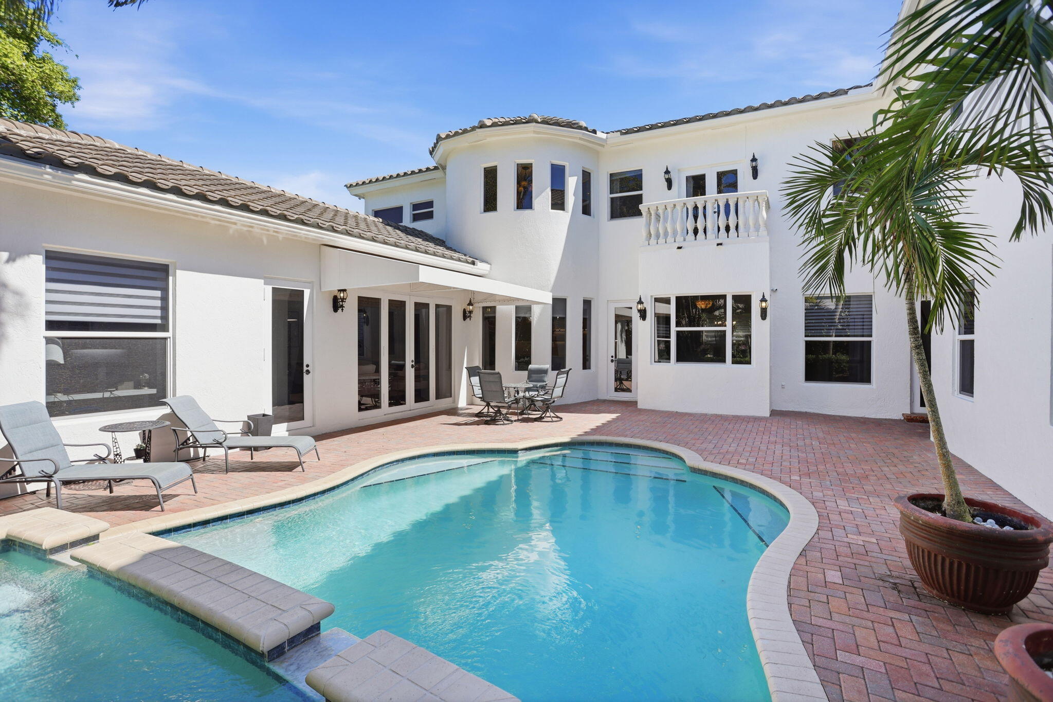 375 Southwest 16th Street Boca Raton, FL 33432 - Photo 3 of 42 a view of a patio with swimming pool table and chairs