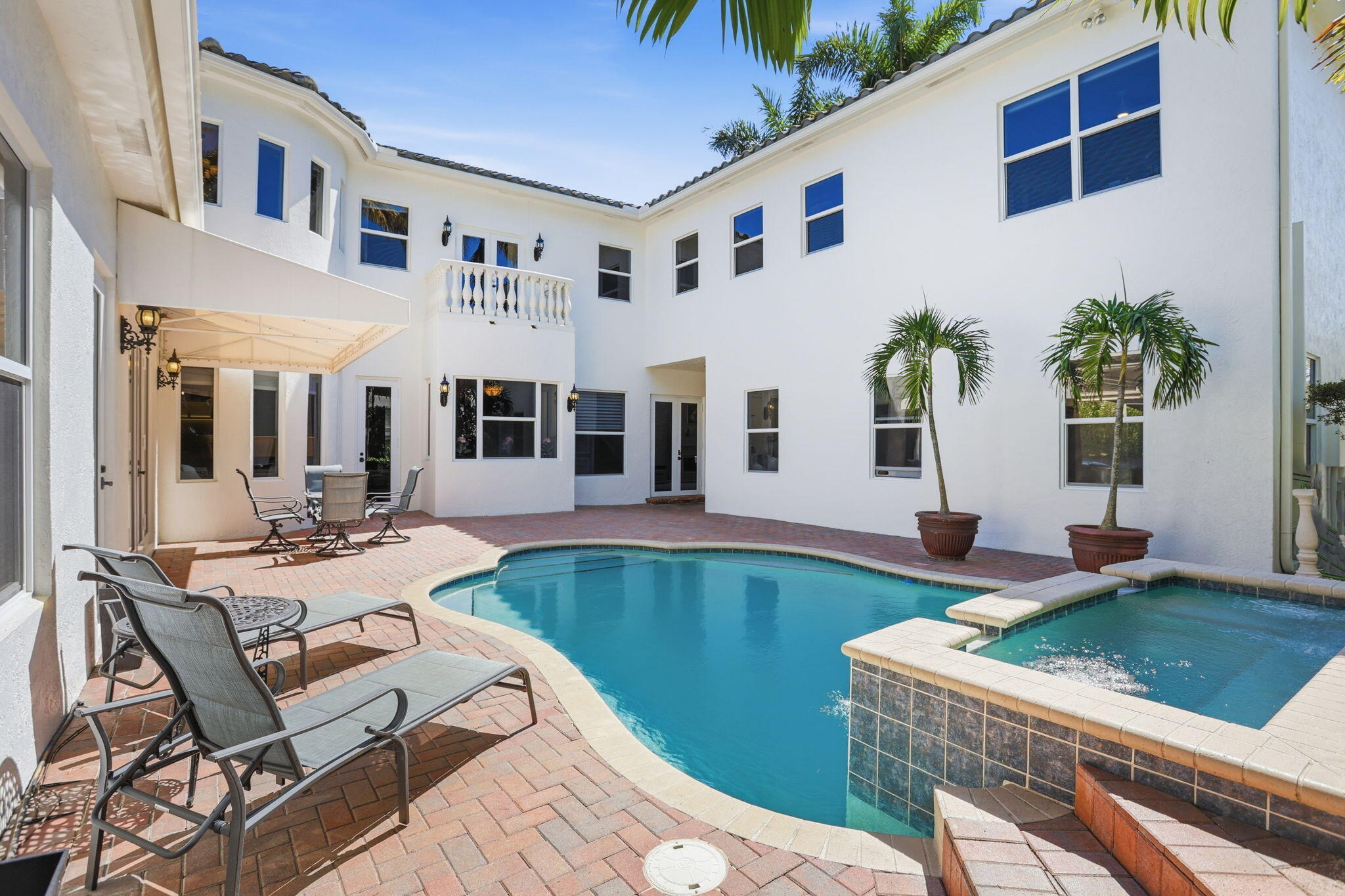 375 Southwest 16th Street Boca Raton, FL 33432 - Photo 4 of 42 a view of a house with swimming pool and sitting area