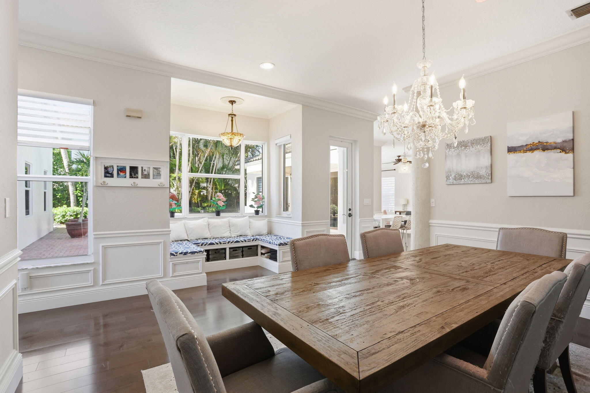 375 Southwest 16th Street Boca Raton, FL 33432 - Photo 9 of 42 a dining table seating on a table and a chandelier