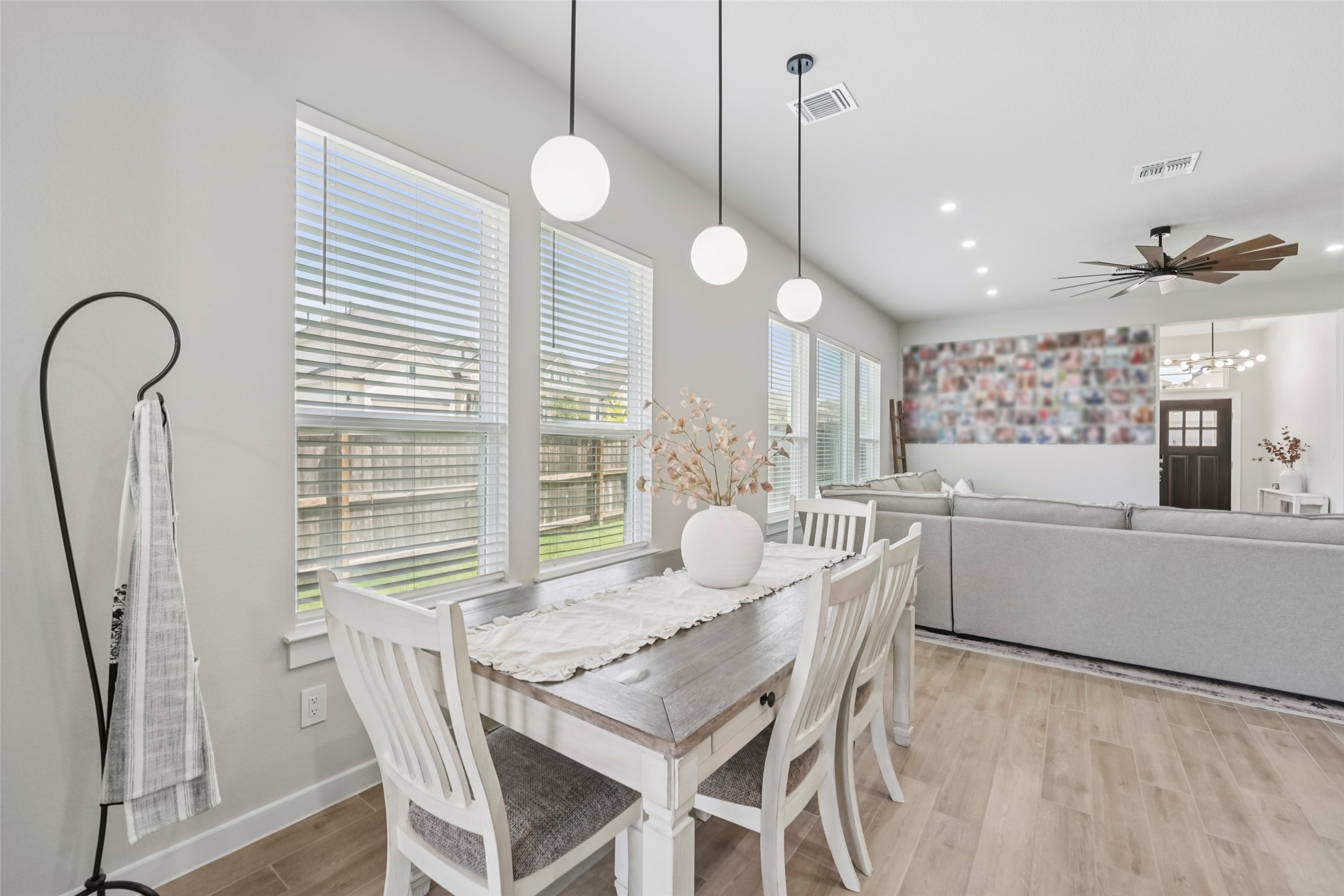 1108 Sweetspire Street Leander, TX 78641 - Photo 11 of 39 Dining room featuring healthy amount of natural light, light wood finished floors, a ceiling fan, and recessed lighting