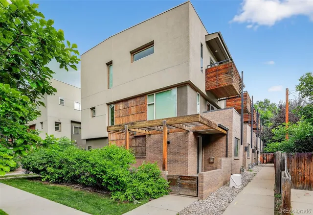 a view of a white building among the street