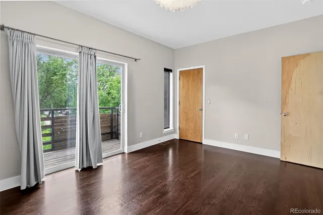 an empty room with wooden floor