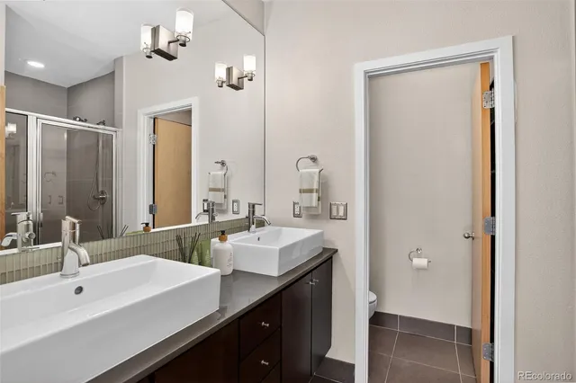 a bathroom with a glass shower door