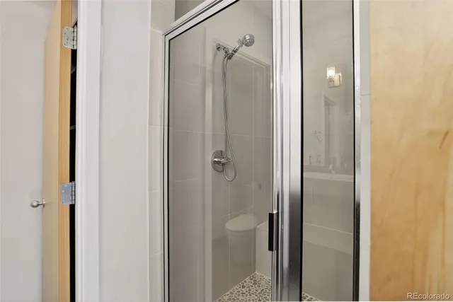 a view of a street with a tree