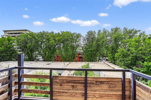 a view of a balcony with two chairs