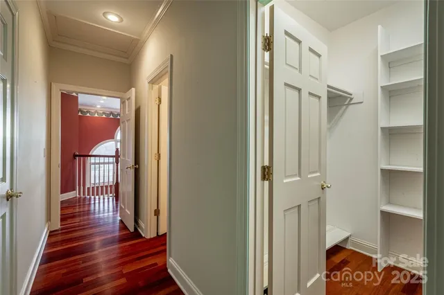 a bathroom with a granite countertop toilet a sink and a mirror