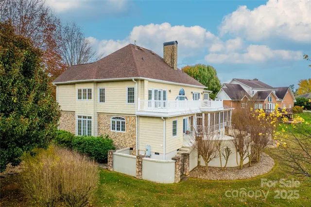 a front view of a house with a yard table and chairs
