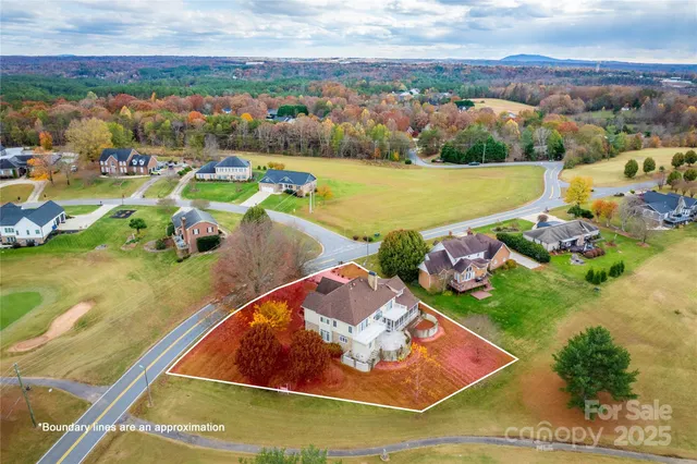 an aerial view of a house with a ocean view