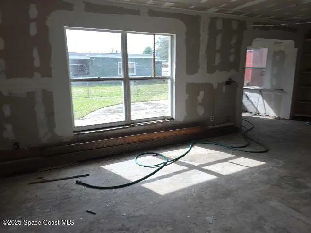 a view of a livingroom with furniture and window