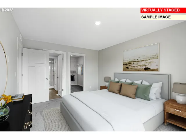 a bedroom with a bed and a night stand