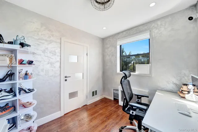 a workspace with furniture and window