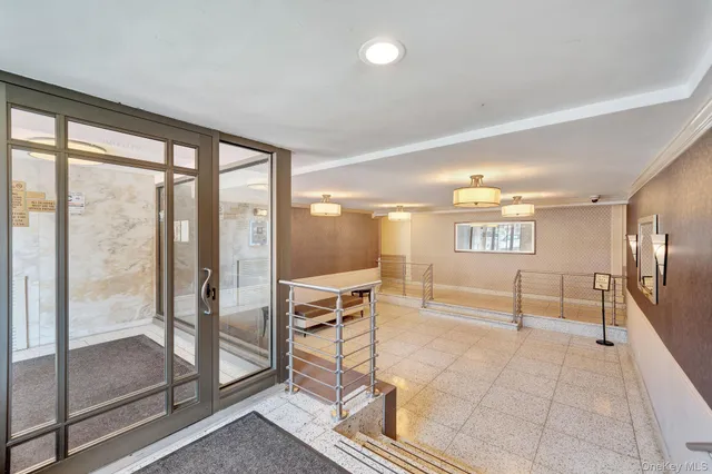 a view of a kitchen with furniture and a floor to ceiling window