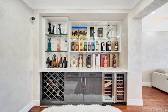 a living room with furniture cabinets and window
