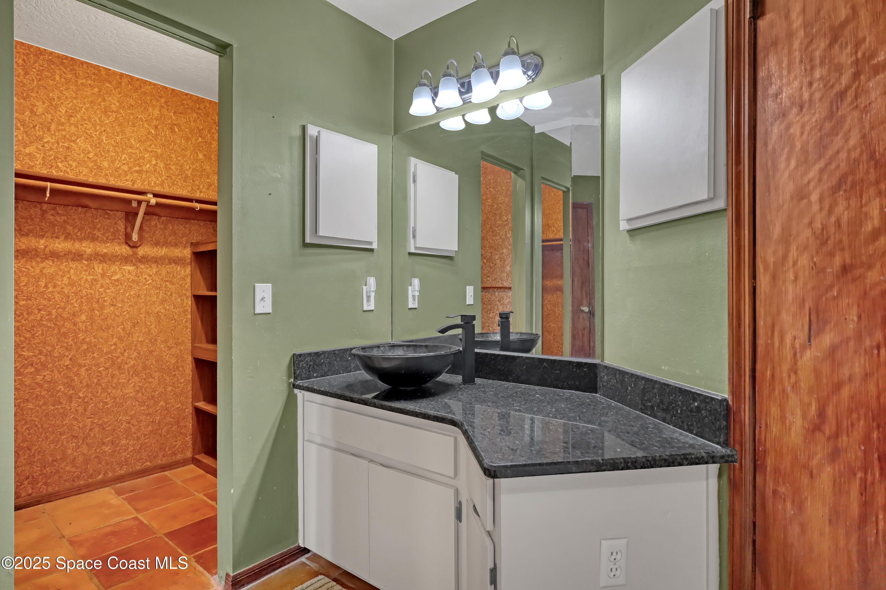 235 Sand Dollar Road Indialantic, FL 32903 - Photo 14 of 64 a bathroom with a granite countertop sink and a mirror