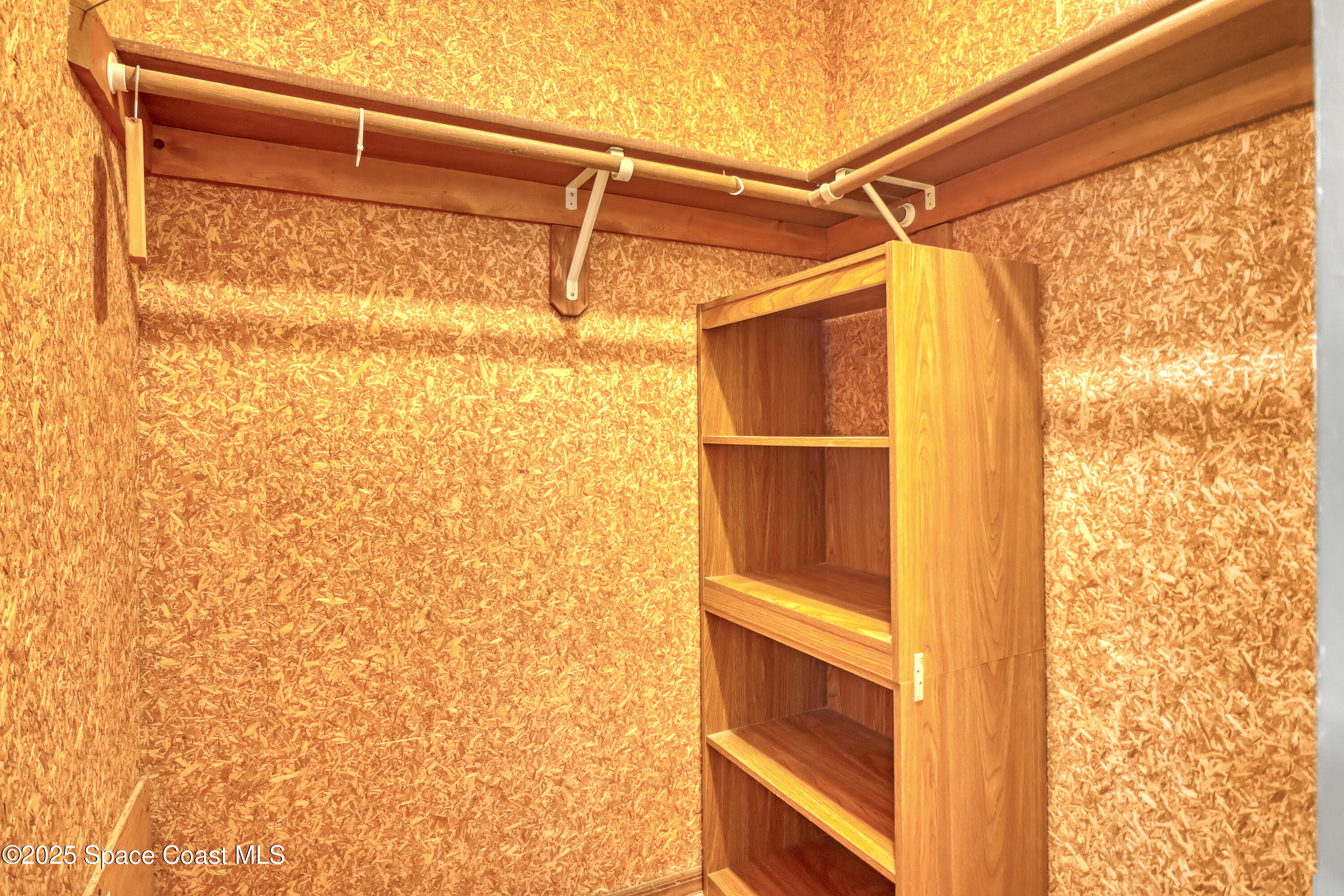 235 Sand Dollar Road Indialantic, FL 32903 - Photo 17 of 64 a view of walk in closet with empty racks