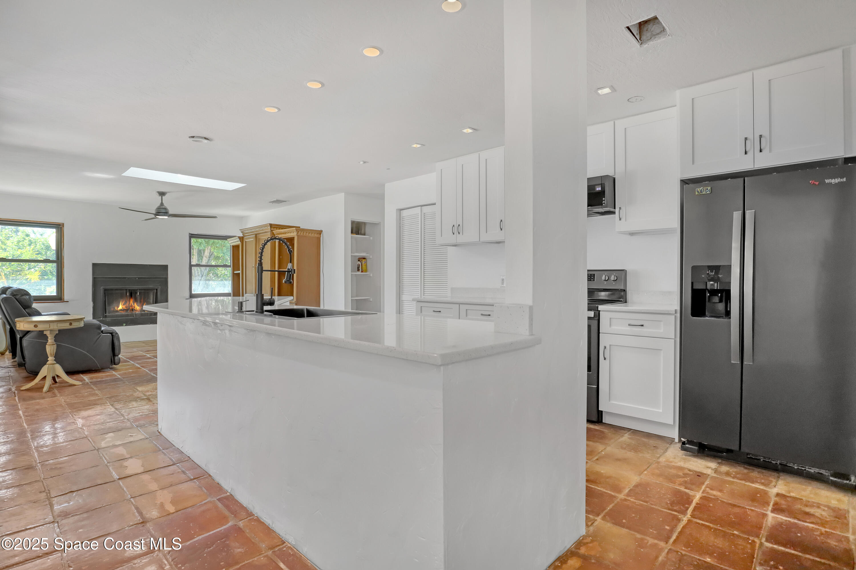 235 Sand Dollar Road Indialantic, FL 32903 - Photo 22 of 64 a kitchen with stainless steel appliances a refrigerator and a stove top oven