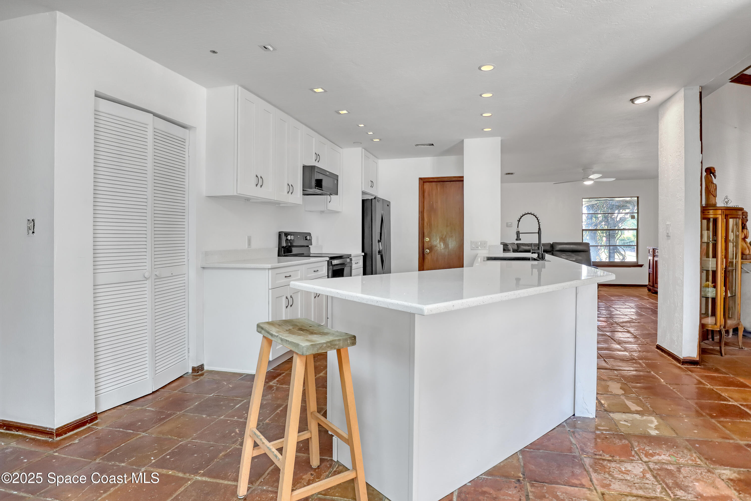 235 Sand Dollar Road Indialantic, FL 32903 - Photo 27 of 64 a view of kitchen with refrigerator sink and cabinets