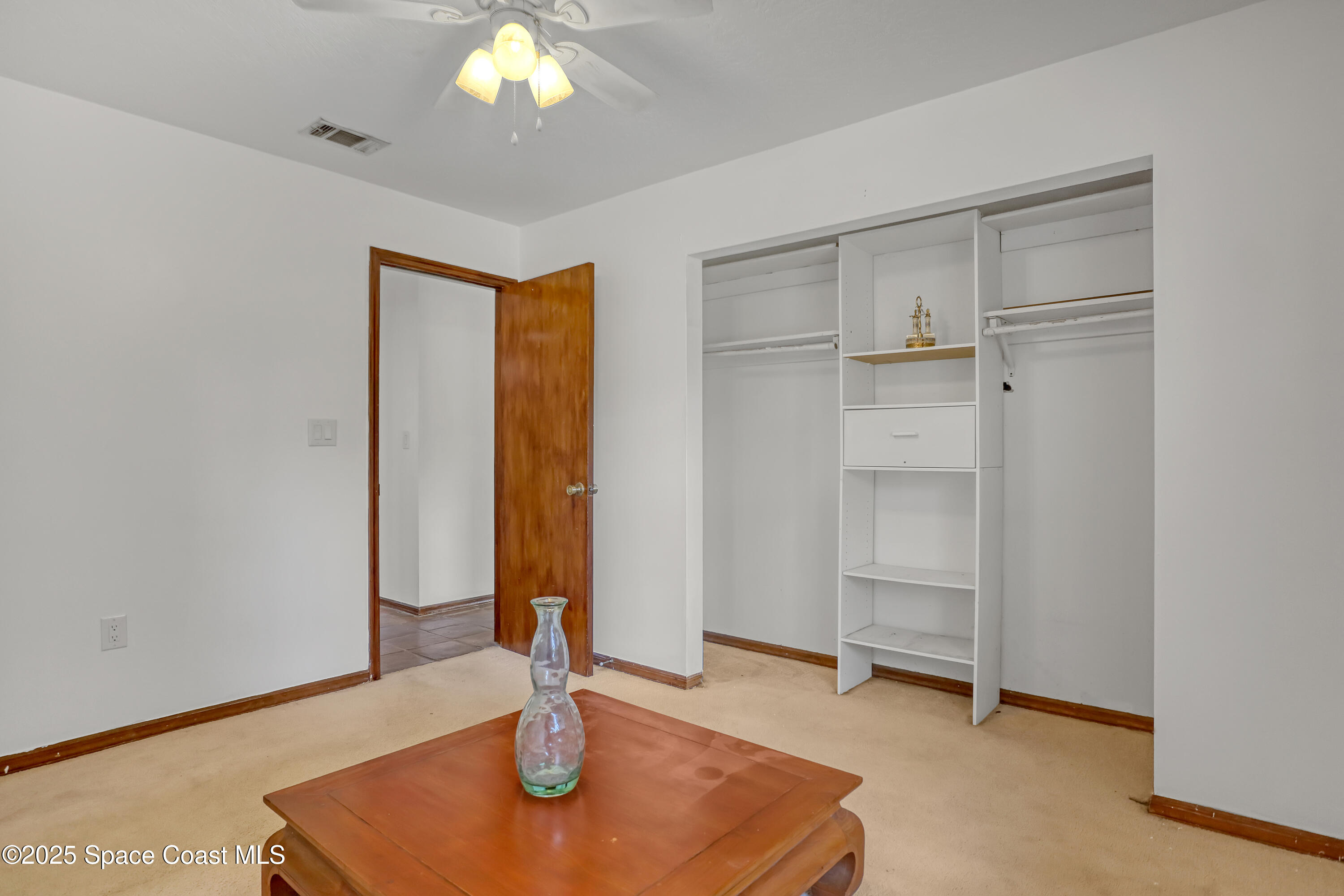 235 Sand Dollar Road Indialantic, FL 32903 - Photo 36 of 64 a view of empty room with wooden floor