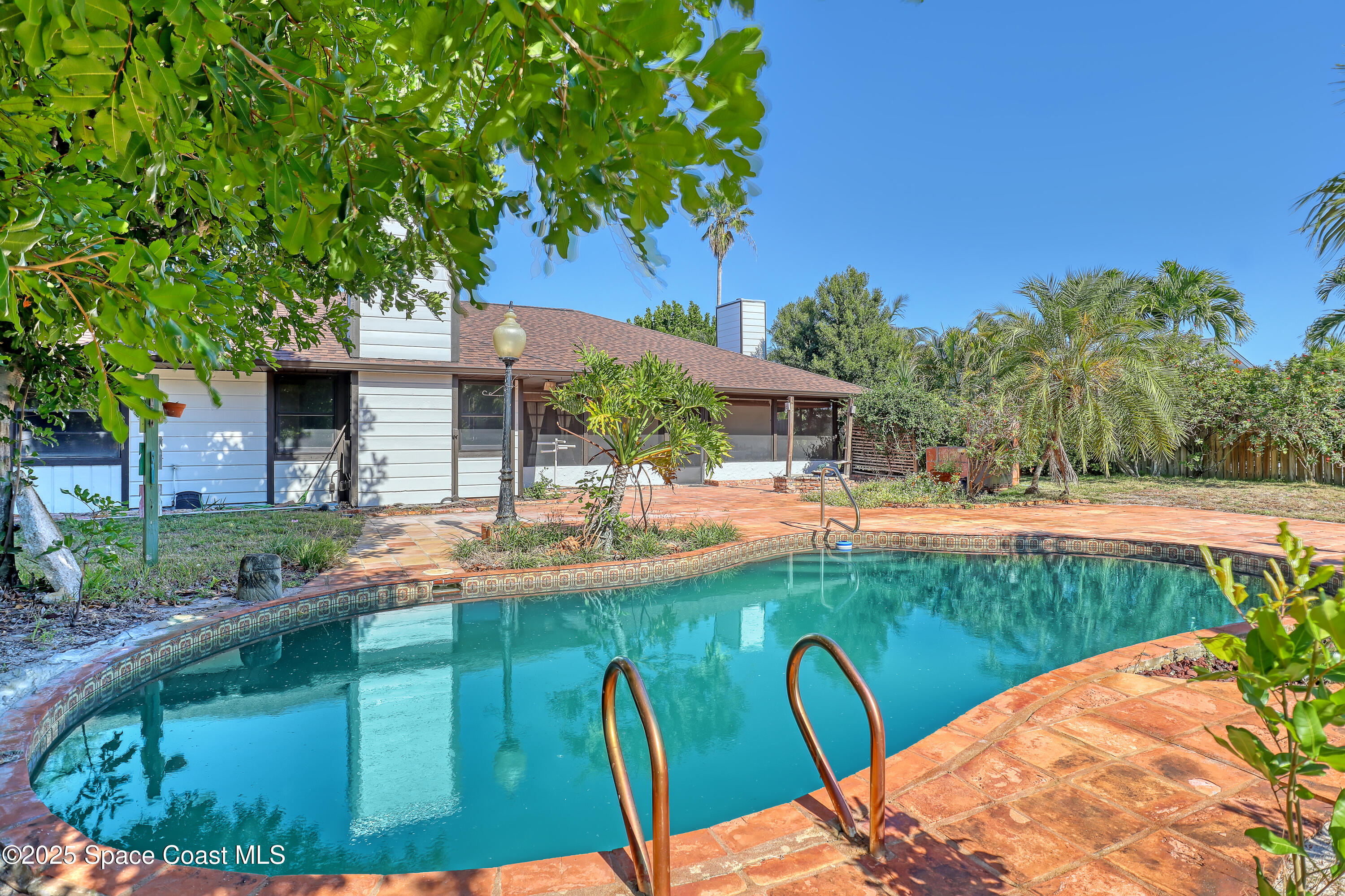 235 Sand Dollar Road Indialantic, FL 32903 - Photo 51 of 64 a view of a swimming pool with a patio