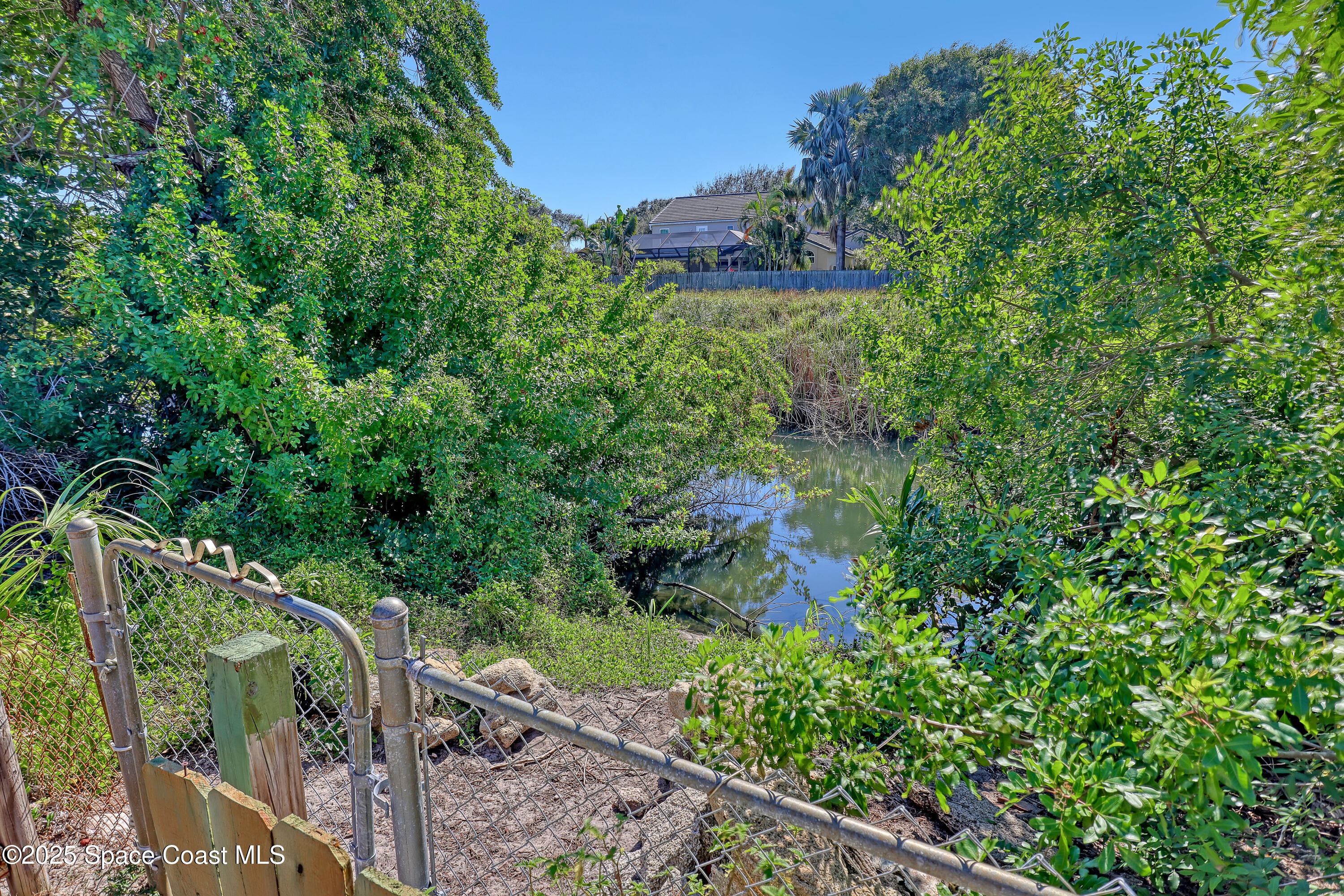 235 Sand Dollar Road Indialantic, FL 32903 - Photo 55 of 64 a view of a wooden bridge