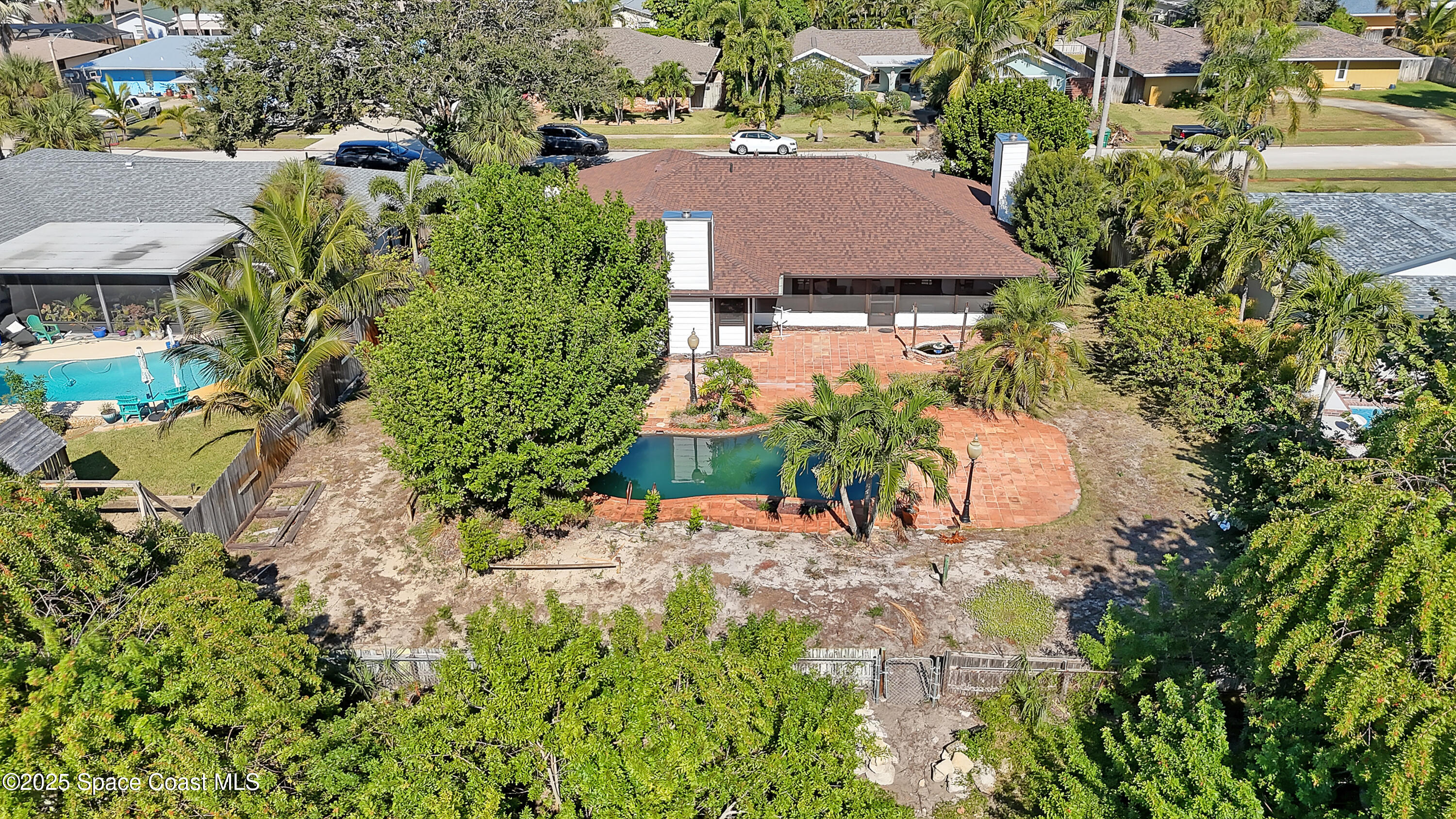 235 Sand Dollar Road Indialantic, FL 32903 - Photo 56 of 64 an aerial view of a house with a yard and garden