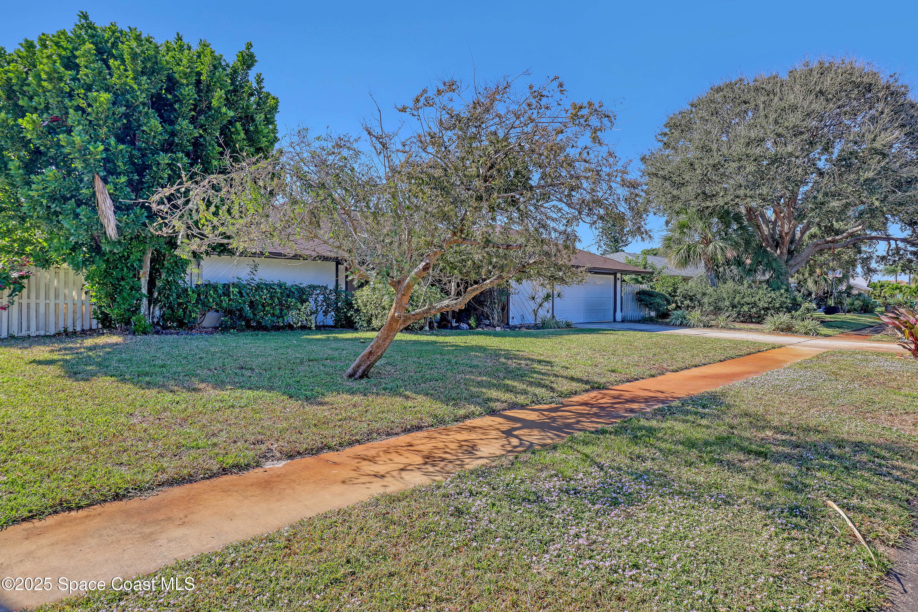 235 Sand Dollar Road Indialantic, FL 32903 - Photo 60 of 64 a view of a house with a yard