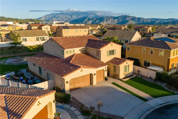 an aerial view of a house with a yard