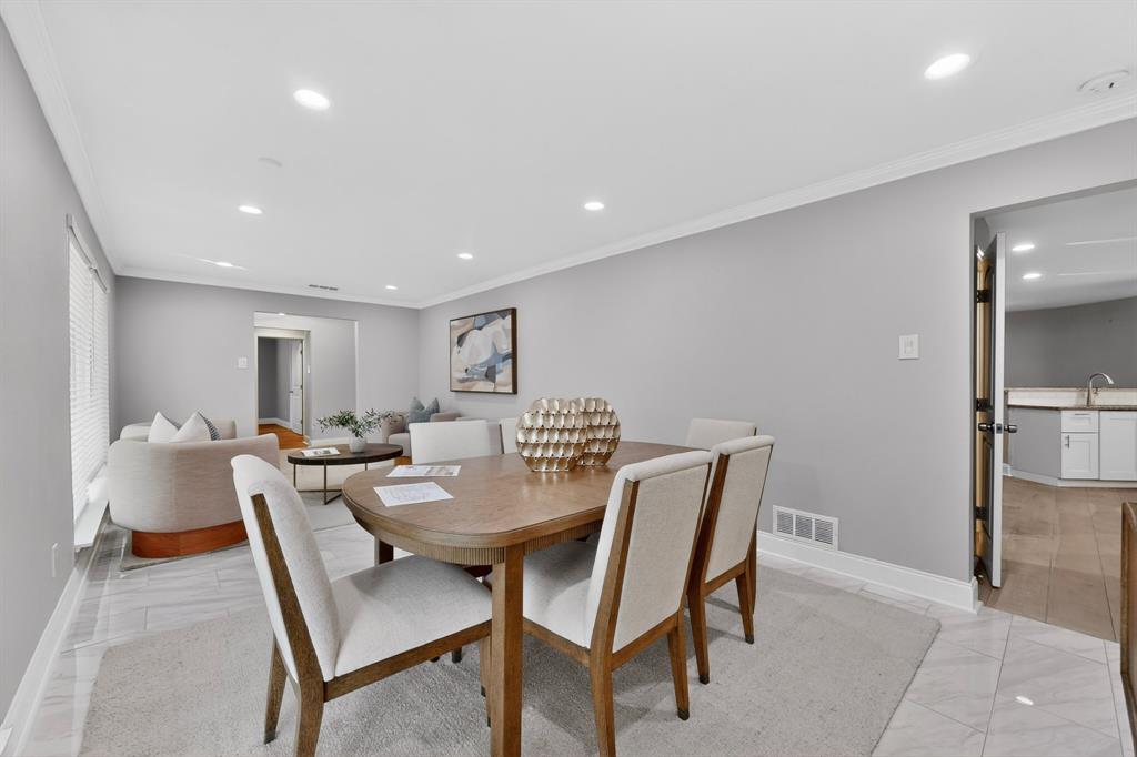 7631 Meadow Road Dallas, TX 75230 - Photo 7 of 40 A bright dining area adjacent to both the living room and kitchen
