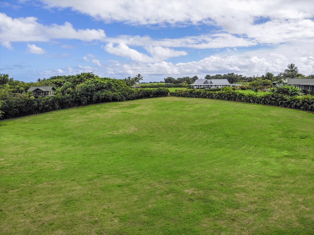 4327 Kapuna Road, Unit 2 Kilauea, HI 96754 - Photo 13 of 30 a view of a big yard with a house in the background
