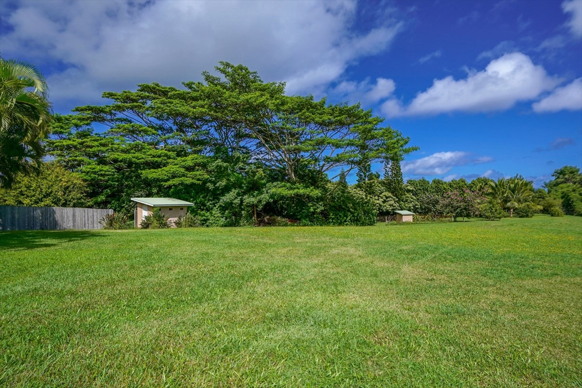 4327 Kapuna Road, Unit 2 Kilauea, HI 96754 - Photo 23 of 30 a view of a garden with a building in the background