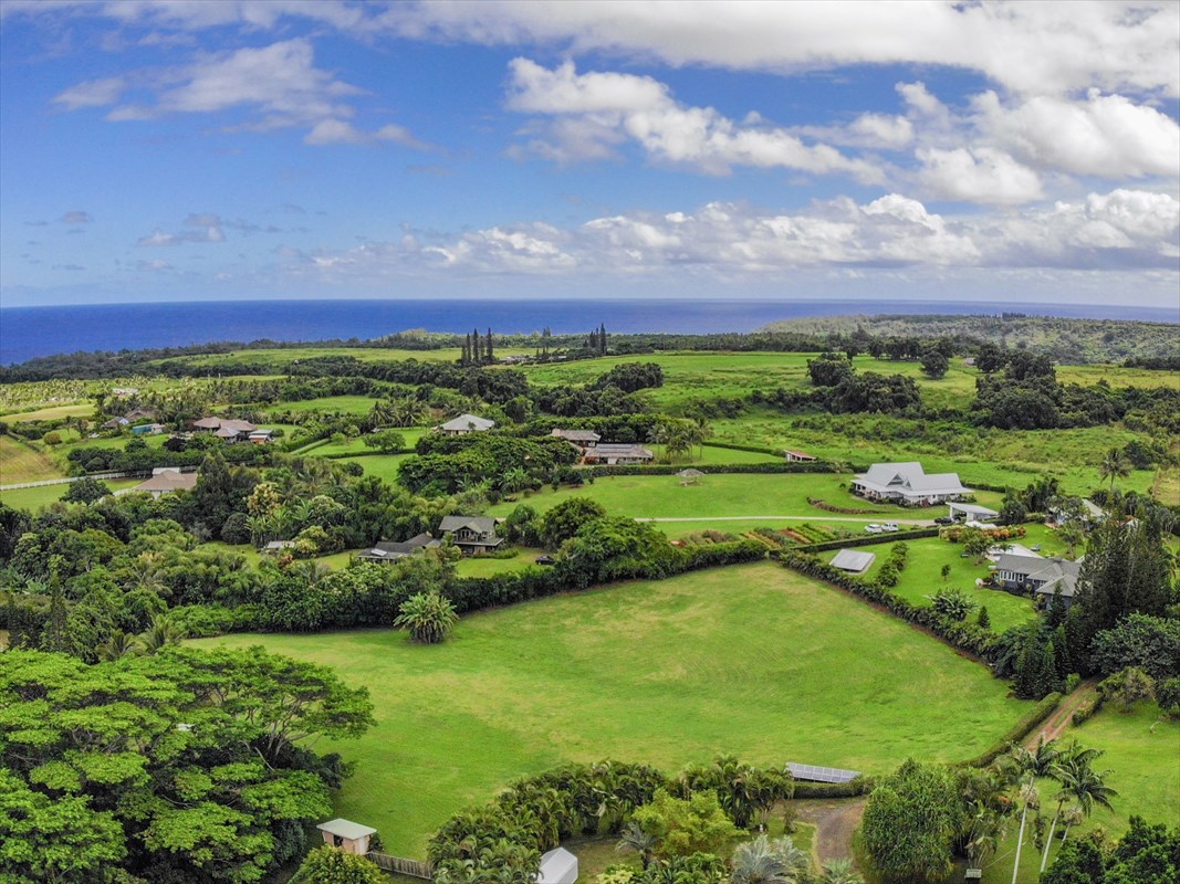 4327 Kapuna Road, Unit 2 Kilauea, HI 96754 - Photo 5 of 30 a view of a lush green outdoor space with a lake view
