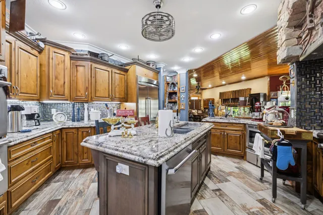 a kitchen with a counter space cabinets and appliances