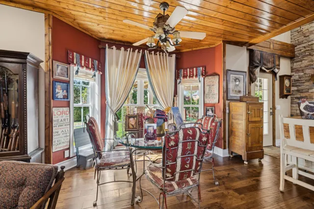 a view of a dining room with furniture window and outside view