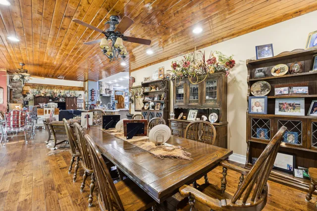 a view of a dining room with furniture and a floor to ceiling window