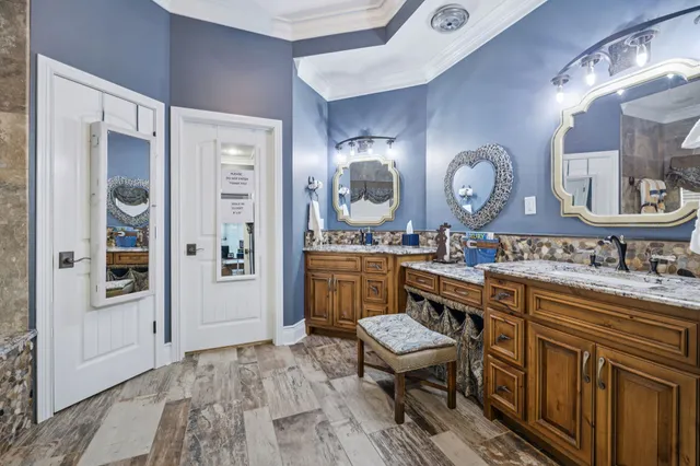 a spacious bathroom with a sink a mirror and a shower