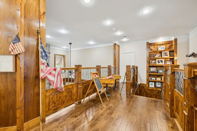 a view of an entryway with wooden floor