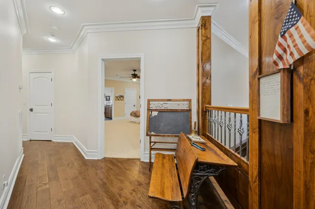 a bedroom with a bed gym equipment and view of living room