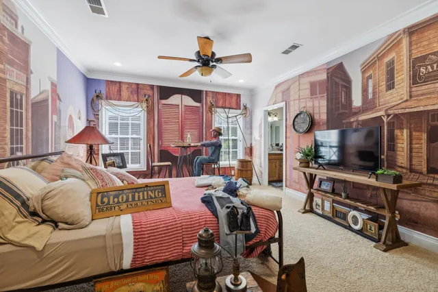 a bed room with a bed and a chair