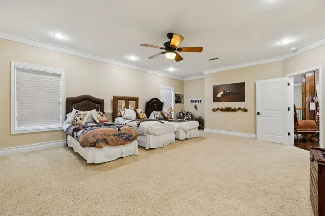 a front view of a house with a yard table and chairs
