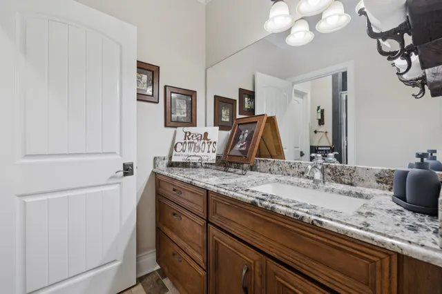 a view of a big house with a big yard and large trees