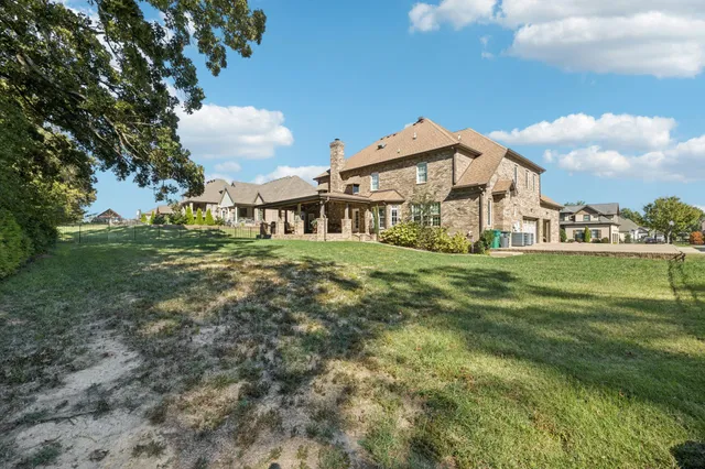 a view of a patio with table and chairs and potted plants