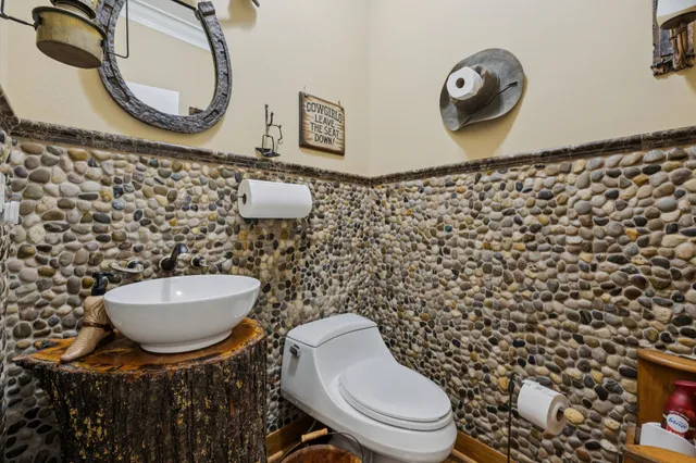 a bathroom with a toilet and a sink
