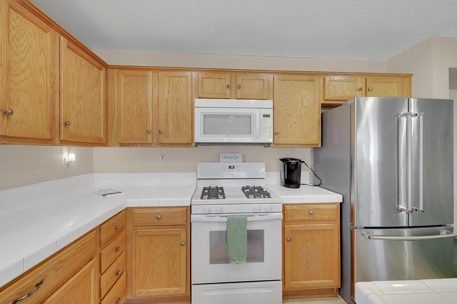 9840 Ellis Way Live Oak, CA 95953 - Photo 22 of 44 a kitchen with a refrigerator sink and stove