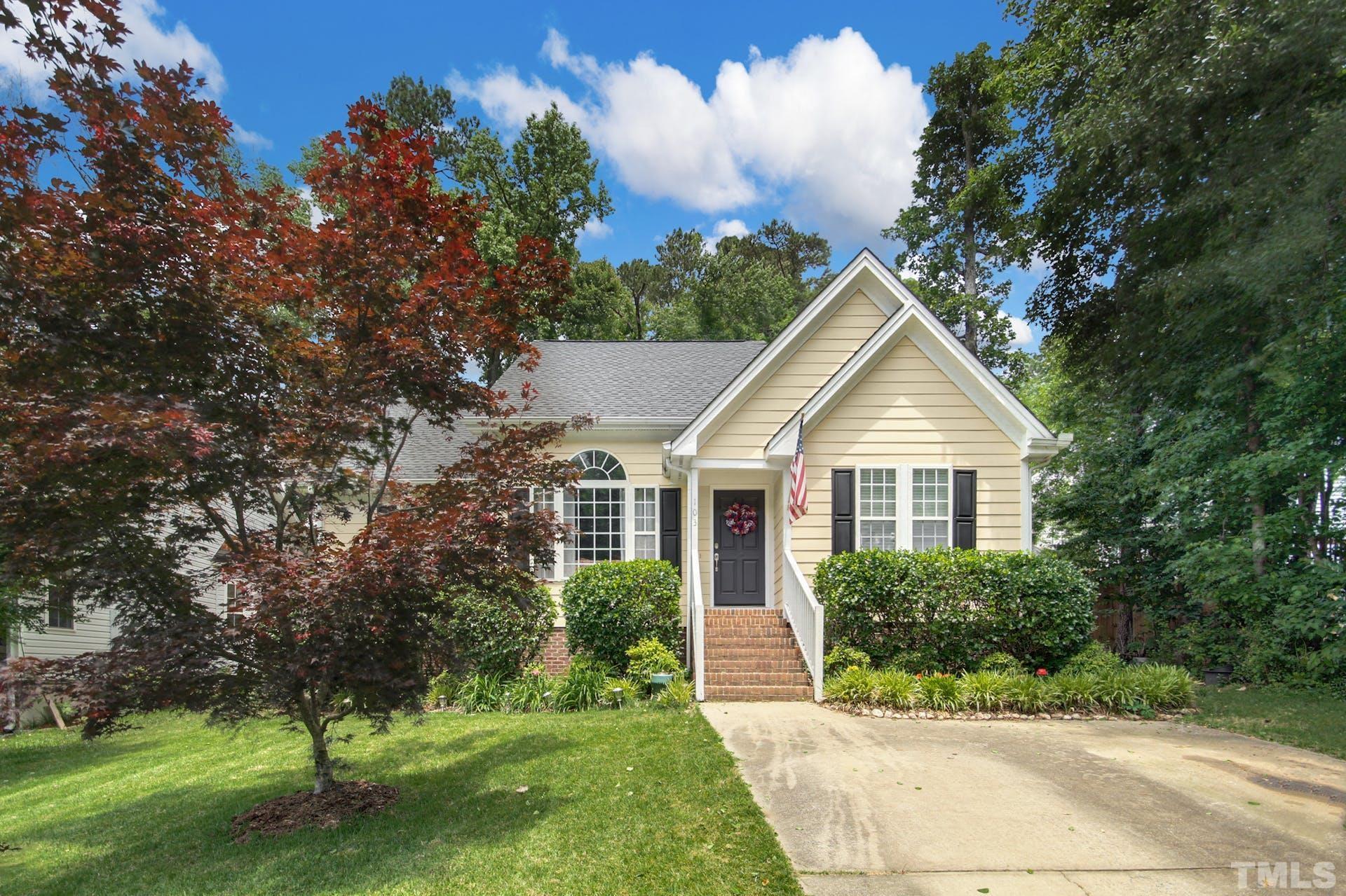 a front view of a house with a yard