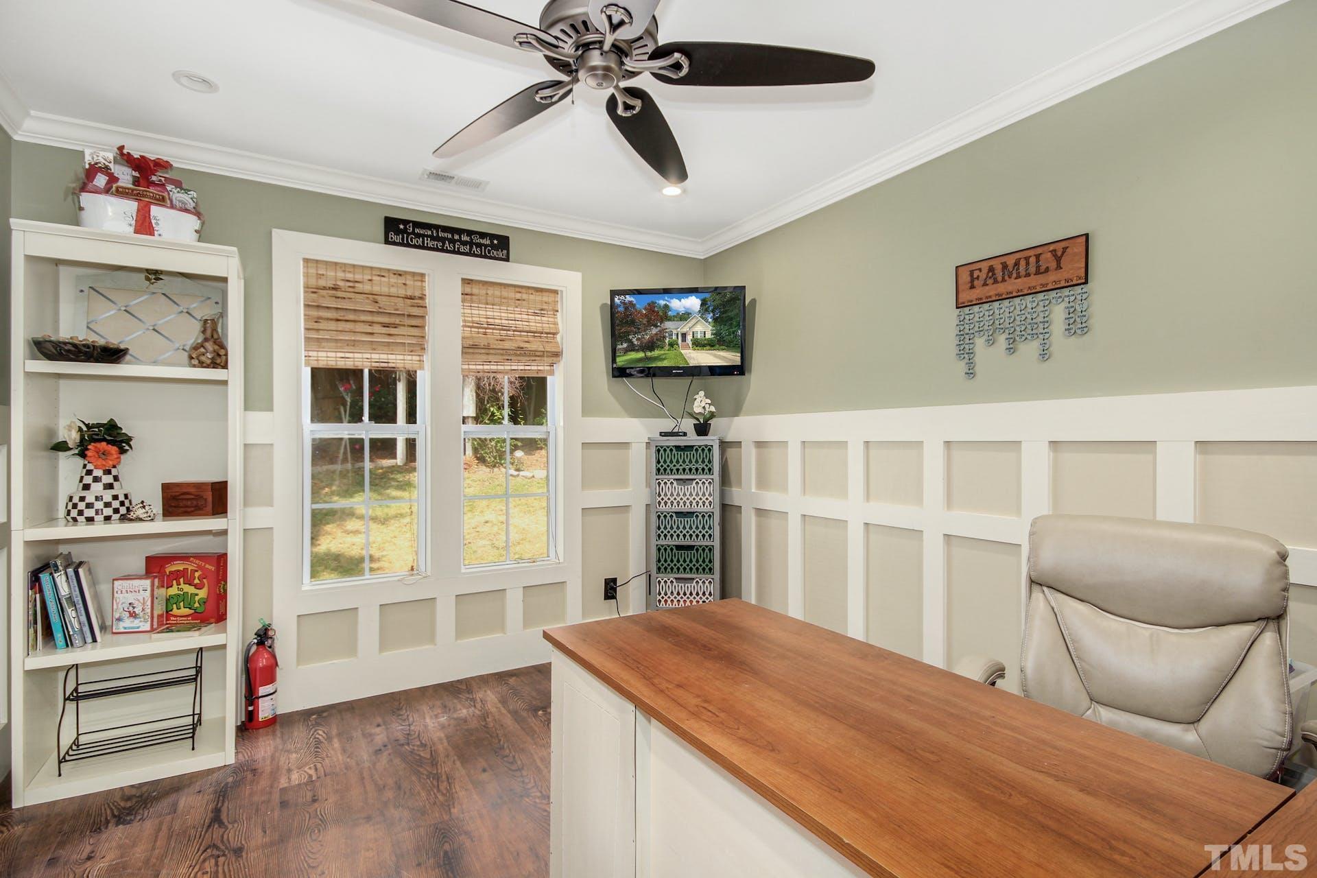 103 Lemon Drop Circle Apex, NC 27502 - Photo 12 of 20 a bedroom with furniture and a book shelf