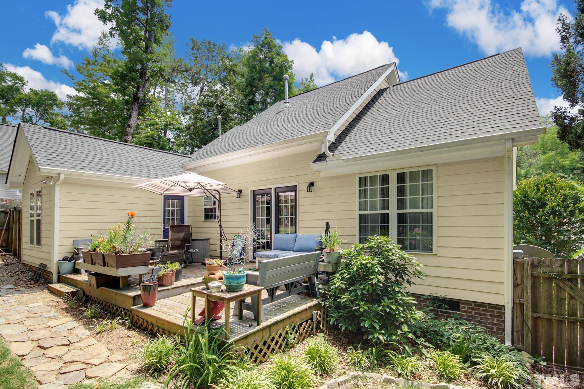 103 Lemon Drop Circle Apex, NC 27502 - Photo 19 of 20 a view of a patio with couches table and chairs and potted plants