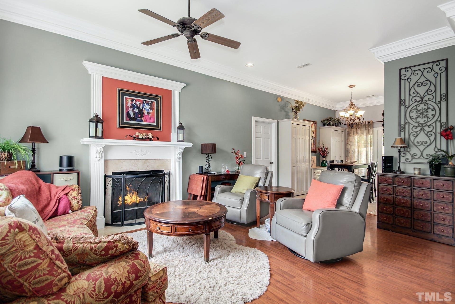 103 Lemon Drop Circle Apex, NC 27502 - Photo 4 of 20 a living room with furniture and a fireplace