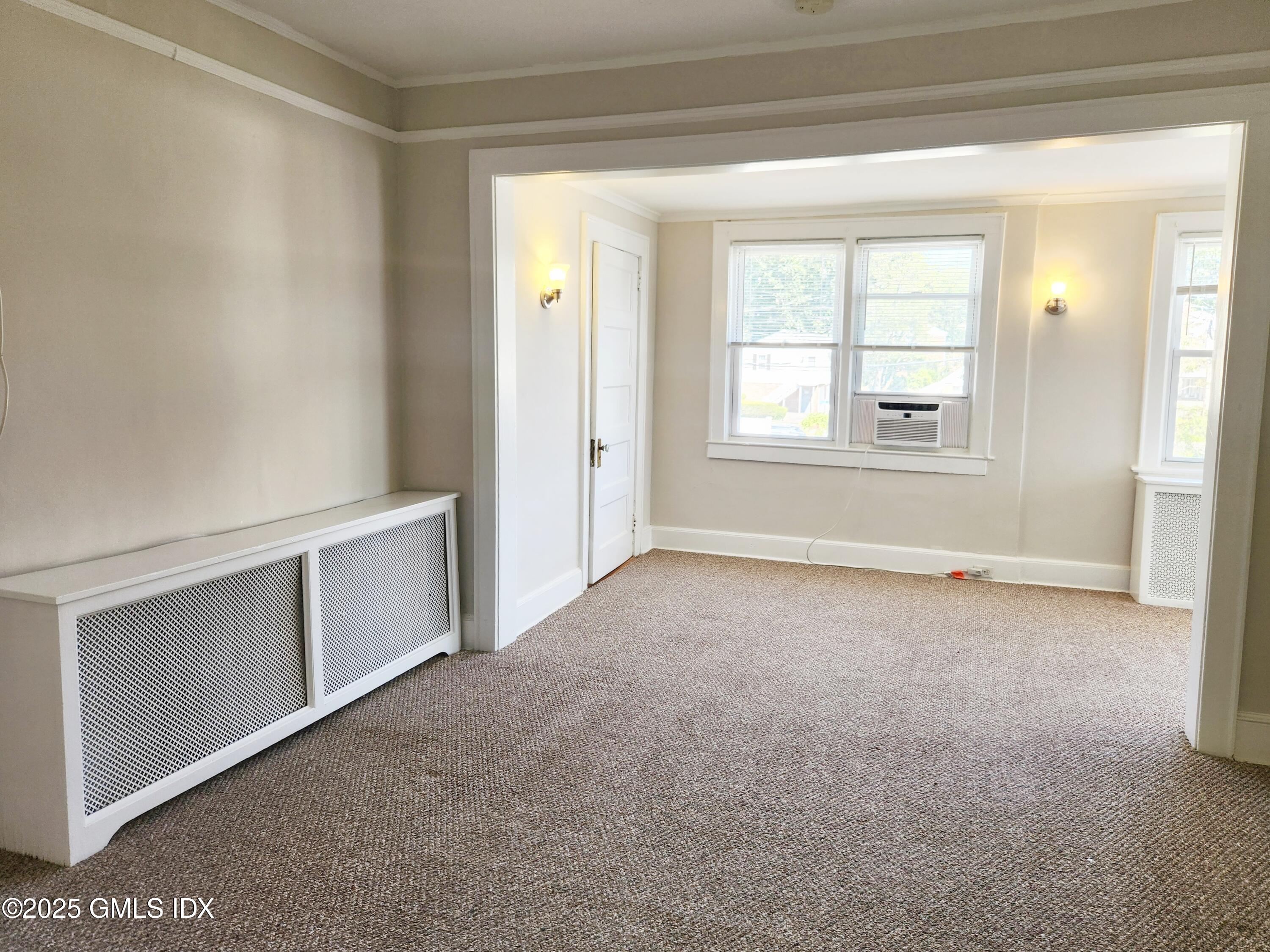 15 Scofield Street, Unit 1F Cos Cob, CT 06807 - Photo 5 of 15 a view of an empty room with a window
