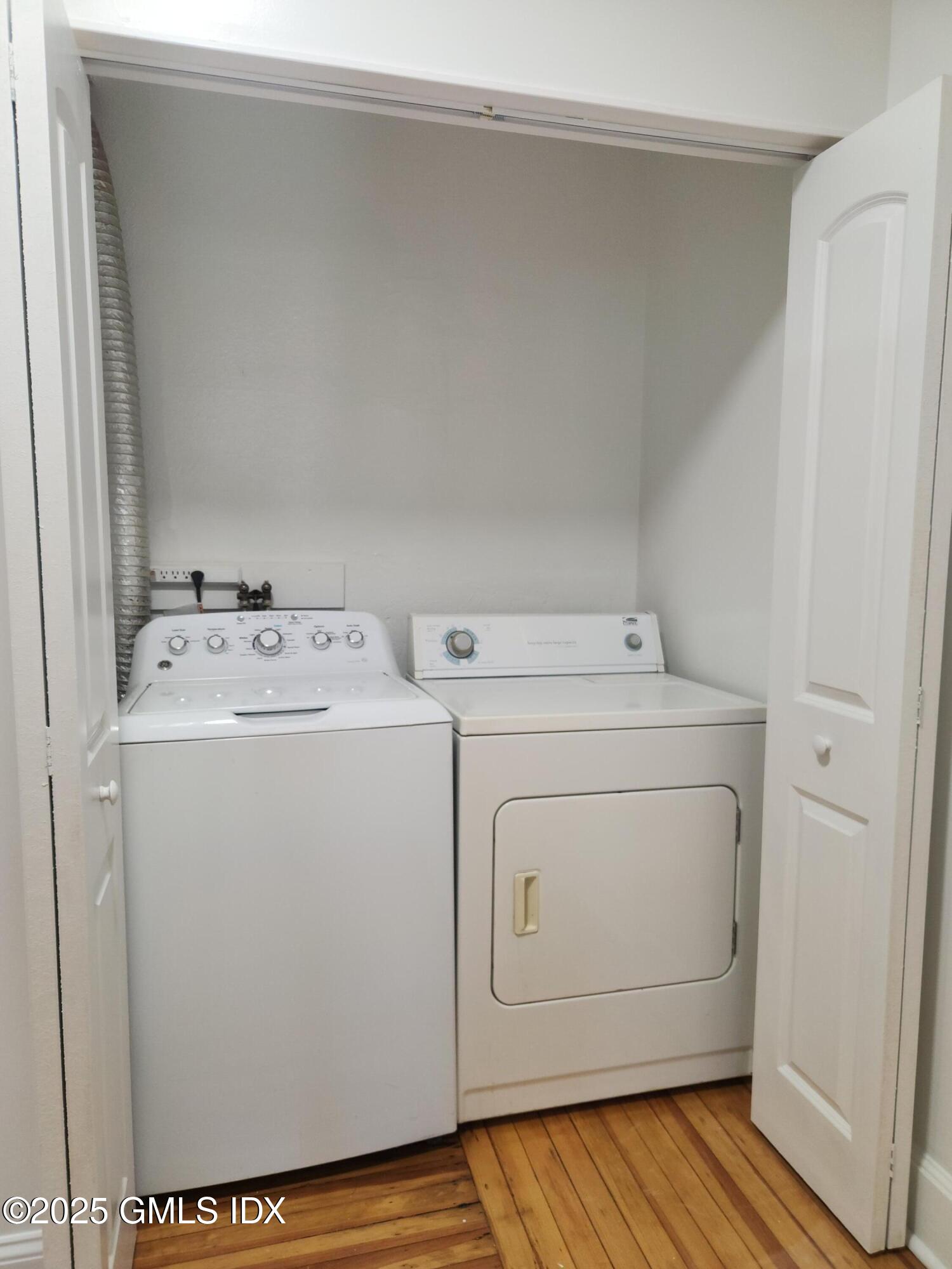 15 Scofield Street, Unit 1F Cos Cob, CT 06807 - Photo 10 of 15 a utility room with dryer and washer